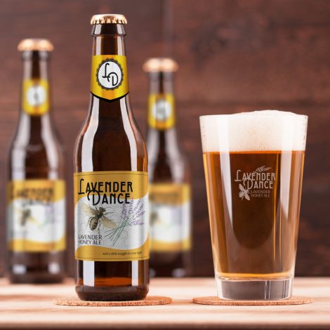Beer bottles and glass with Lavender Dance Honey Lavender Ale Label